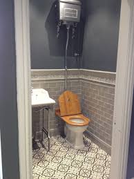 The Striking High Level Toilet Combined With The Brilliant Choice Of Tiles Has Created A Bathroom We Re Genui Downstairs Toilet Edwardian Bathroom Guest Toilet