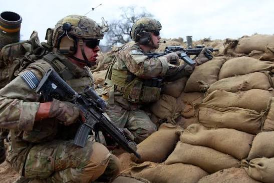 Army Rangers get on line to provide security and lay down suppressive fire  during a live-