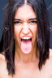 Hairy tongue is when the bumps on the tongue's surface get bigger, resulting in a rough texture, and a discolored and furry appearance. Portrait Of A Beautiful Woman With Her Tongue Out Of Her Mouth Stock Photo Picture And Royalty Free Image Image 77776100
