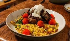 Gradually transfer the couscous to a serving platter, scattering with the cherry tomatoes as you go. Lamb And Pistachio Patties With Couscous Cherry Tomato And Herb Salad Both From Ottolenghi S Simple Quite Possibly The Best Christmas Gift My Boyfriend Got Uk Food