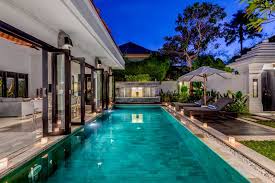 Villa Jepun The Private 8m Pool With Water Feature Is Adjoined By Timber Deck With Rattan Sun Chairs And Umbrella To One Pool Houses Backyard Pool Bali House