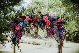 Love the bride floral crown and the groom looks fab in jewel tone suit. Vibrant Jewel Tone Wedding At Core Cider House Junebug Weddings