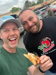 Corvette owner's pizza night with corgi and car modifications