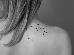 Libra constellation tattoo with flowers. Sagittarius Constellation Tattoo On The Back