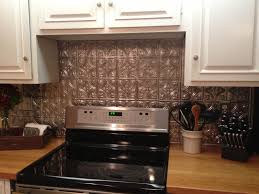 Painting tile backsplash is an easy way to update your kitchen for very little money, but how does it hold up over time? Cool Diy Faux Tin Kitchen Backsplash With Vase Top 12 Faux Tin Kitchen Backsplash Ideas Tin Backsplash Kitchen Metallic Backsplash Kitchen Backplash