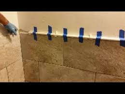 Perfect for a seamless transition. How To Install Mosaic Tile In Bathroom Shower Part 2 Travertine Pencils Liners Installation Youtube