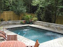 Adding the waterfall, palm trees, and seating. 18 Extraordinary Small Pool Design Ideas For A Backyard Oasis