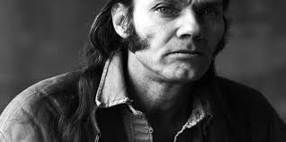 Up from one very hard life, Malcolm Holcombe riding high