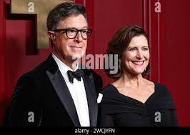 Stephen Colbert and his wife, Evelyn, arrive for the formal Artist's Dinner  honoring the recipients of the 2012 Kennedy Center Honors hosted by United  States Secretary of State Hillary Rodham Clinton at