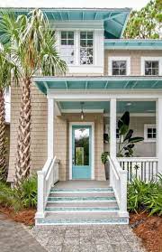 Cottage cream brings a bit of sunny brightness to this beach house color scheme without being too prominent. 31 Ideas For Exterior House Paint Color Combinations Beach Home Beach House Colors Exterior House Paint Color Combinations House Paint Exterior