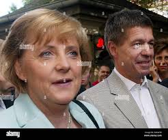 Angela merkel and her husband joachim sauer hi-res stock photography and  images