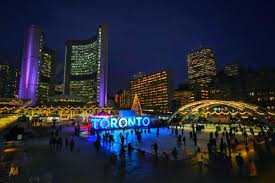 Fireworks over the glowing arches at Nathan Phillips Square for Cavalcade of Lights