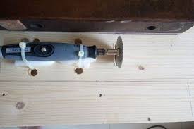 Picture Of Securing The Dremel Engraving End To The Floorboard Dremel Table Saw Dremel Table Saw