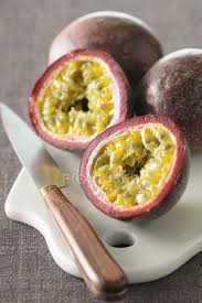 How do i choose the best passion fruit? Passion Fruit Cut In Half On White Desk With Knife Background Color Stock Photo 157143652