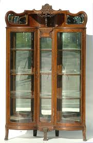 The corner cupboard features a narrow drawer above two doors below. Wooden Cabinets Vintage Antique Corner China Cabinet