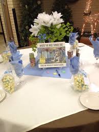 Classic Children S Books As Centerpieces For Baby Shower Tables Girl Baby Shower Centerpieces Storybook Baby Shower Baby Girl Shower Themes