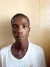 Armed police officers are moving in to arrest the living or dead body of  Edriss Bility