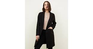 Taking its cue from military suiting, trousers are reissued in a narrow waisted silhouette while jackets take on new proportions with exaggerated shoulders. Black Single Breasted Formal Coat New Look
