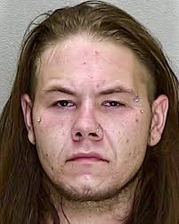 Spruce Creek South man arrested after found slumped over wheel of vehicle