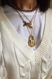 Gold Necklace Layering With Our Lv Padlock In 2021 Gold Necklace Layered Chanel Pearl Necklace Necklace