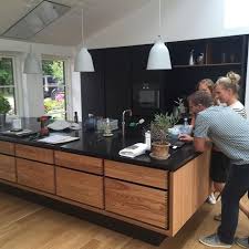And i love the look of it as long as the hinges aren't exposed as black hinges can look a bit harsh and show the age of the cabinets more than hidden hinges. 56 Black Kitchens With Light Wood Ceiling Ideas Black Kitchens Wood Ceilings Kitchen Design