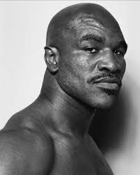 🥊 Evander “The Real Deal” Holyfield the only four-time Heavyweight  Champion in boxing history. Reigning through the late 90s and early 2000s,  he stood tall among giants. 🔥 Involved in legendary rivalries