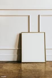 Download Premium Image Of Blank Frame By A White Wall 1224385 Frame White Photo Frames Gallery Wall Mockup