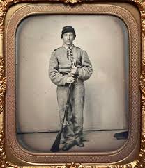 Thought to be an unknown member of the 27th Mississippi Infantry. Note the  round corner CS buckle he is wearing.
