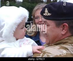 Bombadier Robert Burrows from Barry, South Wales with daughter Rebecca aged  7 months in Newport Stock Photo