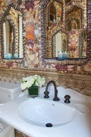 It ties the space together by picking up the cool tones spotted in the quartz countertop. Pin By Margie Mariott Barbee On My Beach House Seashell Bathroom Moroccan Bath Sea Shell Decor