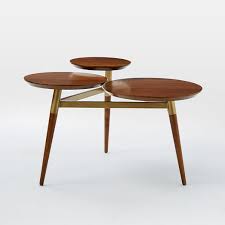 Featuring an open concept modern design that provides 3 spacious glass shelves for decoration, collections or art objects. Clover Coffee Table Walnut Antique Brass