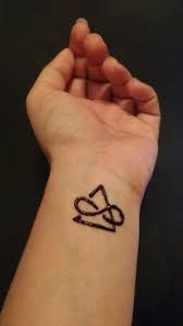 Wrist Tattoo Henna Delta Is A Symbol For Change The Triangle With The Gap Means Open To Change Infinit Tribal Tattoos Tattoos Infinity Tattoo On Wrist