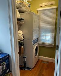 Now this is a laundry room we wouldn't mind spending time in. These cement  checkered floors add so much personality to this small space. Swipe to see  the laundry room before.