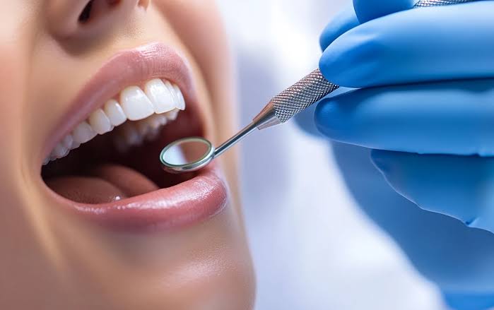 Dentist examining patient at Profrea