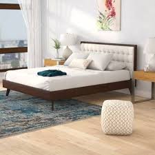 This beautiful upholstered platform bed features upholstered headboard that adds a contemporary chic look to your bedroom and filled in thick foam to add extra comfort. Abril Tufted Solid Wood And Upholstered Low Profile Platform Bed Upholstered Platform Bed Wood Platform Bed Modern Platform Bed