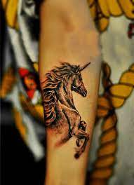 Free Tattoo Designs Unicorn Tattoo On The Arm Unicorn Tattoos Unicorn Tattoo Designs Free Tattoo Designs