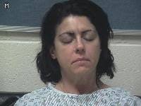 Woman arrested after wrong-way crash