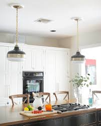 As seen on fixer upper, the aquilar's renovated kitchen has a large island, new flooring, and large silver pendants, giving the room a modern feel. New Kitchen Pendants The Chronicles Of Home