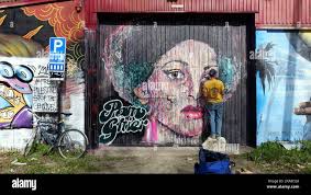 Woman with bicycle painting hi-res stock photography and images