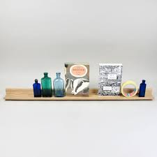 This twist on the traditional photo ledge features a top ledge with a lip to keep the frame from tipping out and falling off. Oak Picture Ledge Long Black Bough Ludlow