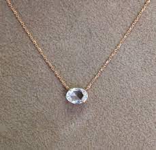 This graceful diamond pendant features over forty round brilliant cut diamonds in a striking oval design. Single Diamond Oval Pendant Diamond Jewelry Necklace Diamond Pendant Diamond Solitaire Necklace