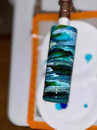 Make a design on the tile using the hot glue gun. Facebook