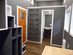 For décor harmony, pick a tile color that either complements the wall color or color of the fixtures in the bathroom. Man Cave By Upper Valley Tiny Homes Tiny Living