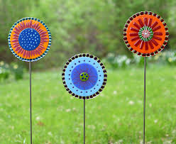 Garden flowers are great for outdoors, and come attached to a metal copper pole which then can be placed on a stake or rebar wire in the ground to match your desired height. Lolly Flowers Garden Stakes By Terry Gomien Art Glass Sculpture Artful Home