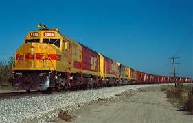 Santa Fe F45 S 5986 5975 5953 And Blue And Yellow Sf30c With A Slug Of Santa Fe Box Cars On The Head End Pump Up The Air At Empire Santa Fe Train Train Tracks