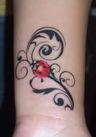 Black Tribal And Red Ladybug Tattoo On Wrist Lady Bug Tattoo Bug Tattoo Ladybird Tattoo
