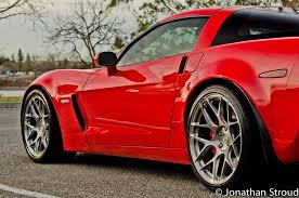 A beautiful jetstream blue chevrolet corvette c6 grand sport showcasing a set of s5 signature series finished in the satin black center, gloss black lip, and chrome hardware combination. Hre Wheels P40sc Wheels 19 20 Chevrolet Corvette Z06 Grand Sport Zr1 C6 C7