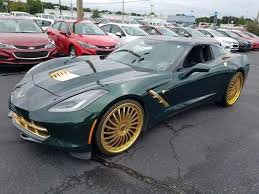 It's a stunning gold car with a cool design on it. Pics This 2014 Corvette Stingray Is The Cheapest C7 On Ebay Corvette Sales News Lifestyle