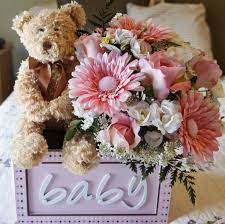 Baby socks are potentially the cutest things in existence. Baby Shower Arrangement Flower Arrangement Teddy Bear Its A Girl Pink Arrangement Bouncing Baby Bear In Pink New Mom Baby Shower Flowers Baby Bear Baby Shower Baby Shower Decorations