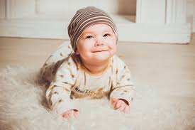 Happy Baby On Fur Baby Boy Clothes Newborn Unusual Baby Names Baby Boy Newborn